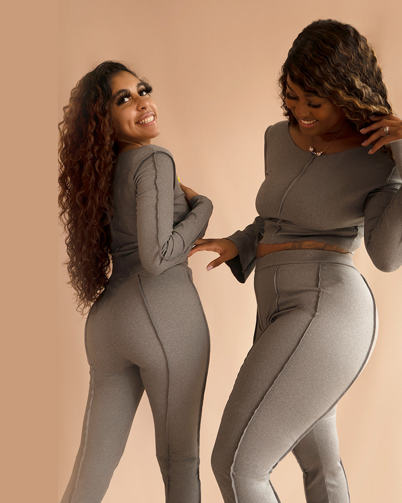 two women posing in gray matching loungewear sets